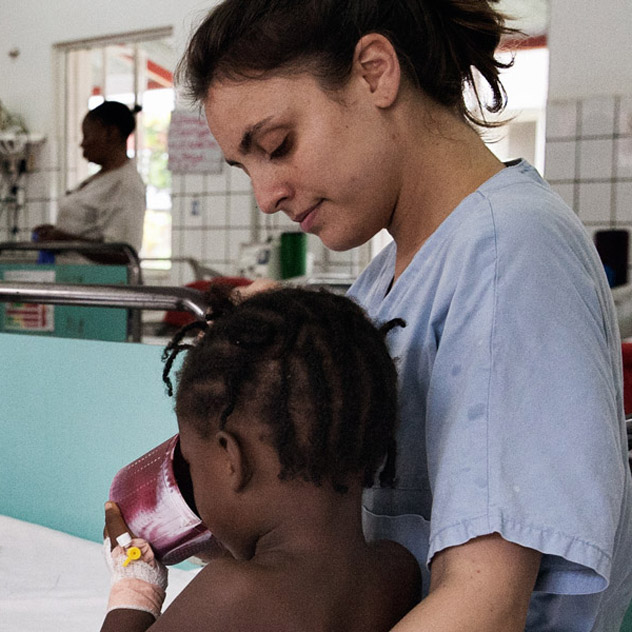 An EMERGENCY nurse taking care of a child in one of the EMERGENCY's Paediatric Centre wards