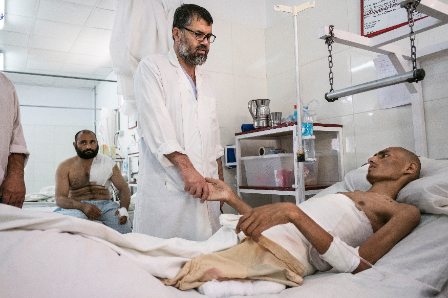 Shah Wali with one of his patients